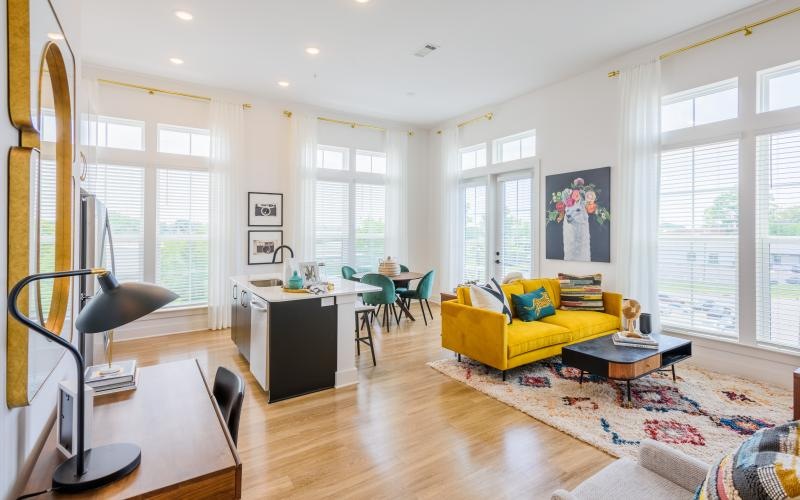 a living room with a yellow couch