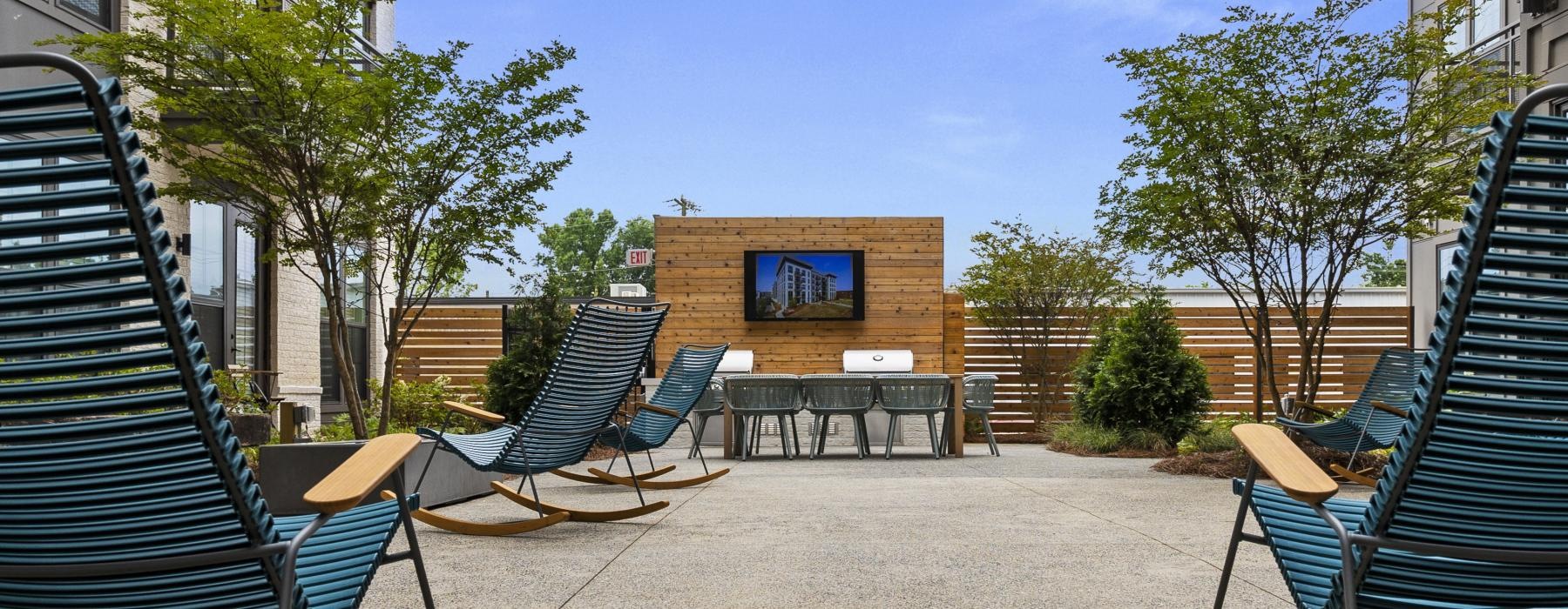 a courtyard with chairs and tables