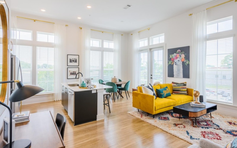 a living room with a yellow couch