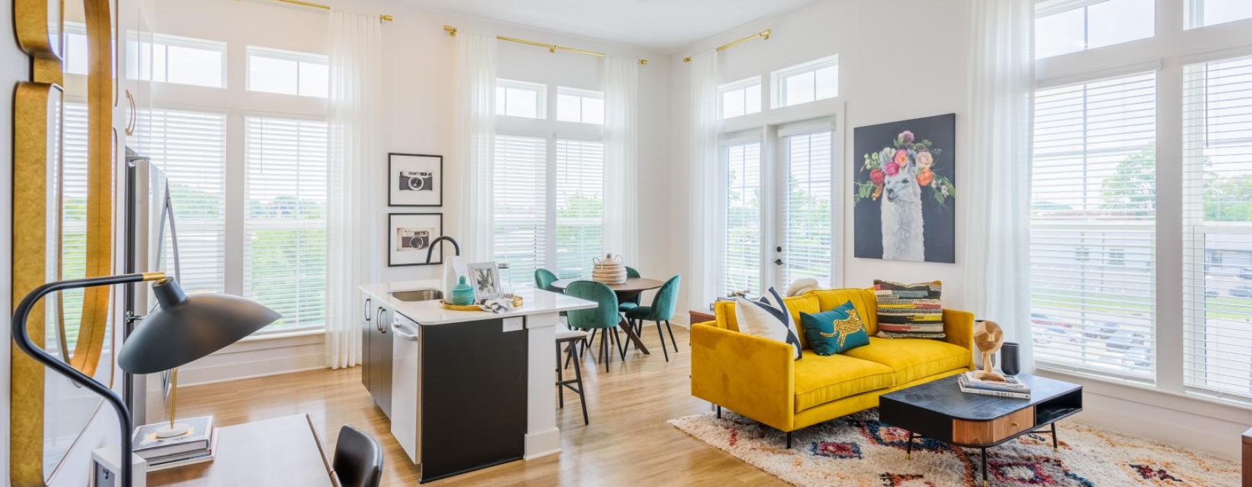 a living room with a yellow couch